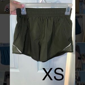 Athletic shorts only worn a couple times. Under armor.Dark green movement/target